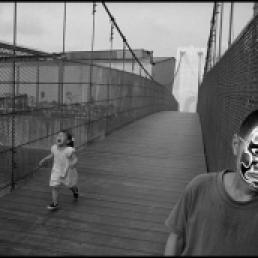 Chien-Chi Chang/ Magnum Photos. TAIWAN Wuri. 2003. My new friend from the village (with mask) and my niece, who finds the new suspension bridge scary.